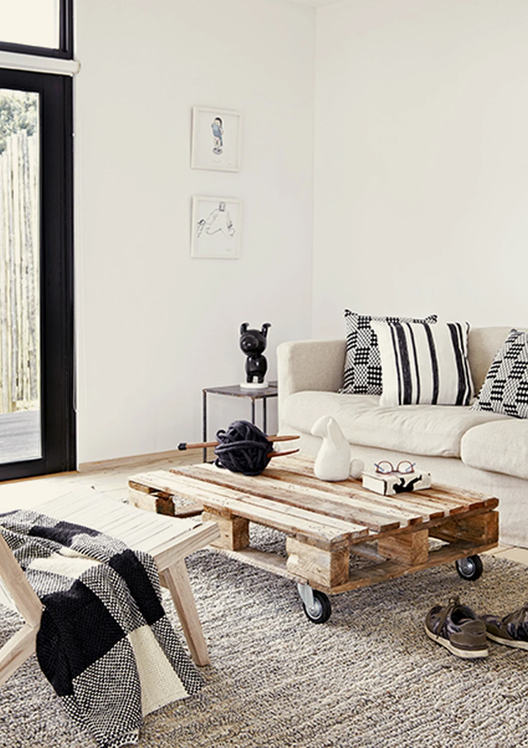 Living room with pallet coffee table and white sofa