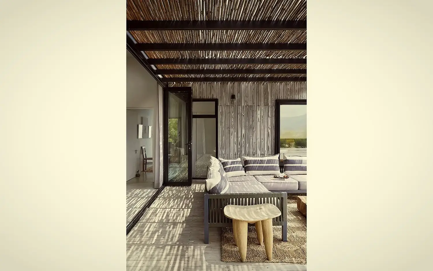 Outdoor bench under the reed-thatched pergola