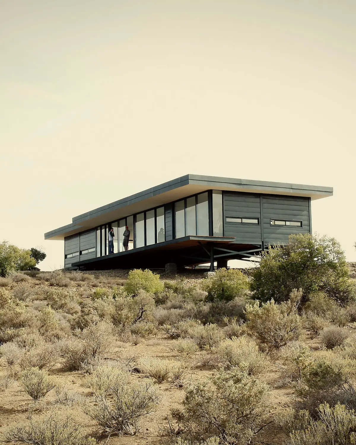South elevation · the building raised on steel piloti above the grassland