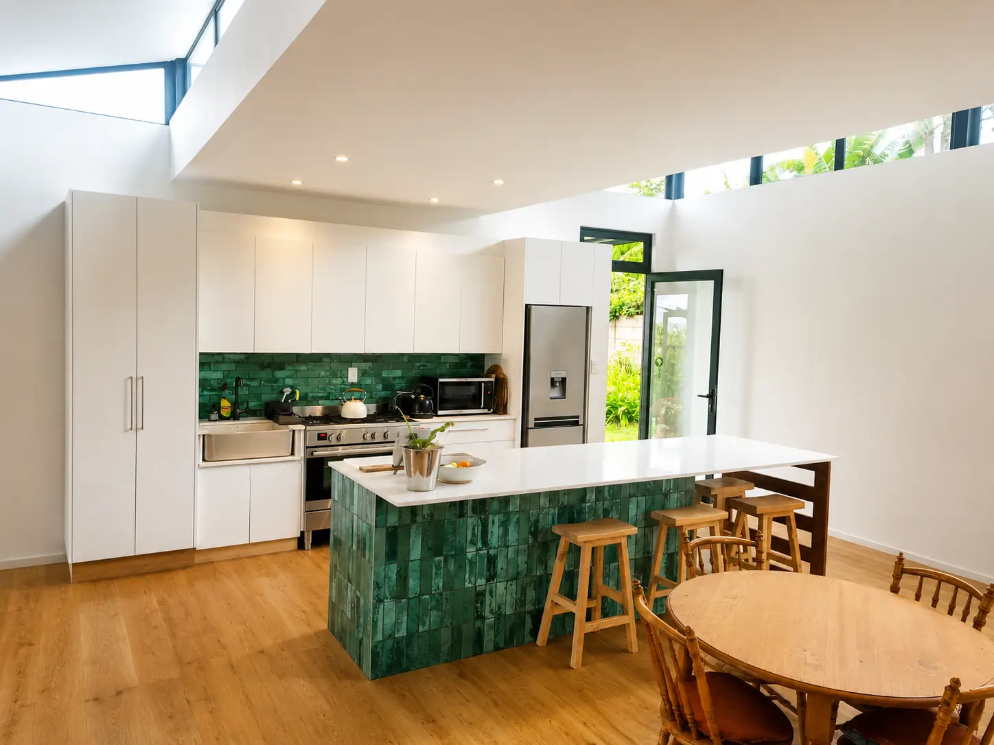 Swellendam Residence kitchen with green tile accents